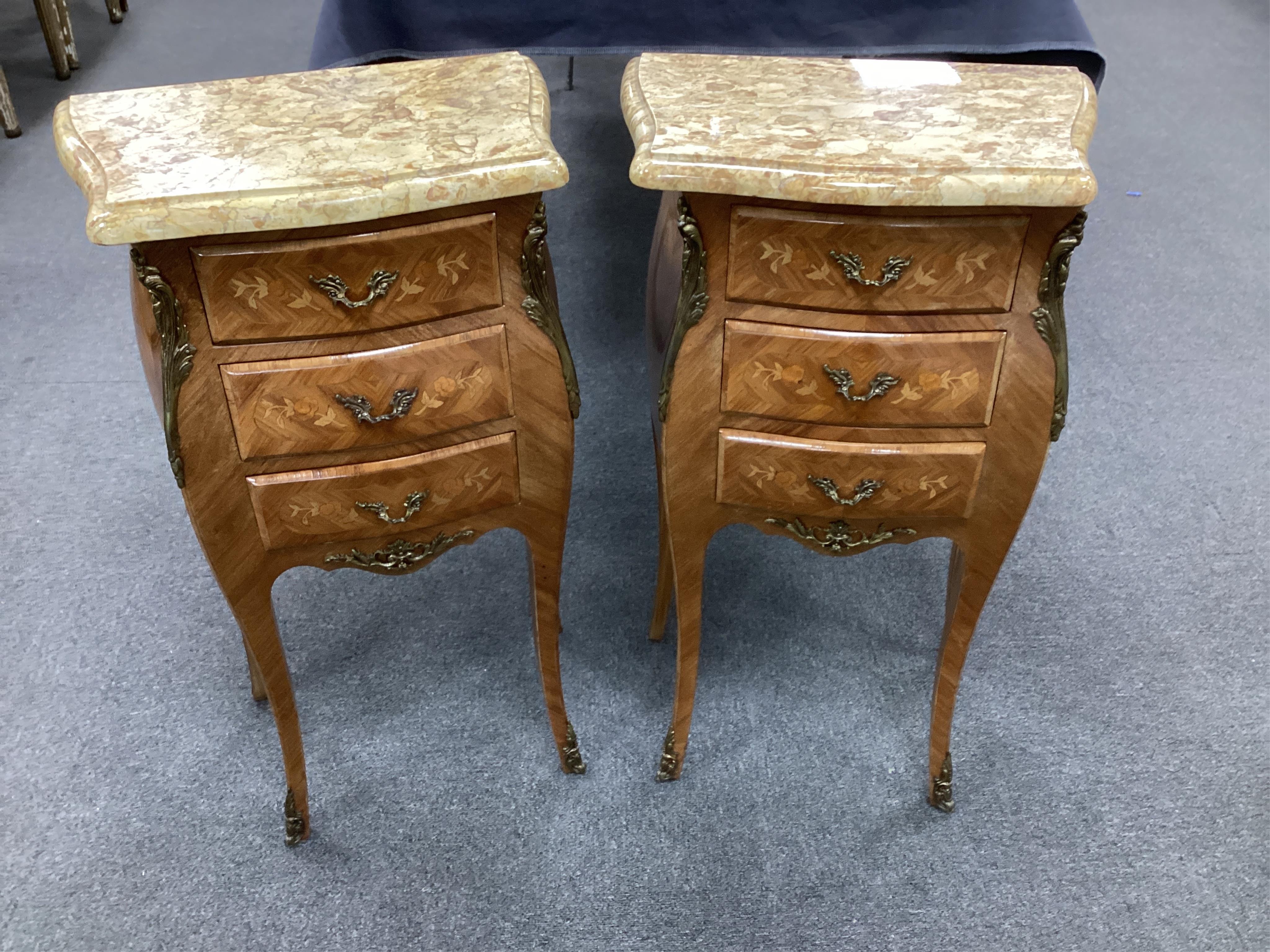 A pair Louis XVI style inlaid kingwood, gilt metal mounted bombe marble top of bedside chests, width 42cm, depth 27cm, height 74cm. Condition- good.